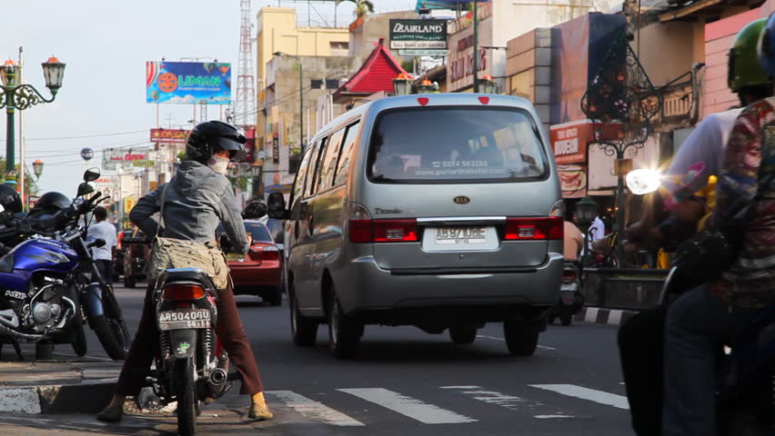 JAVA INDONESIA - June 15 : City life and traffic on Malioboro street in Jogjakarta June 15 2010, Java, Indonesia. With a population of 136 million, Java is the world's most populous island.