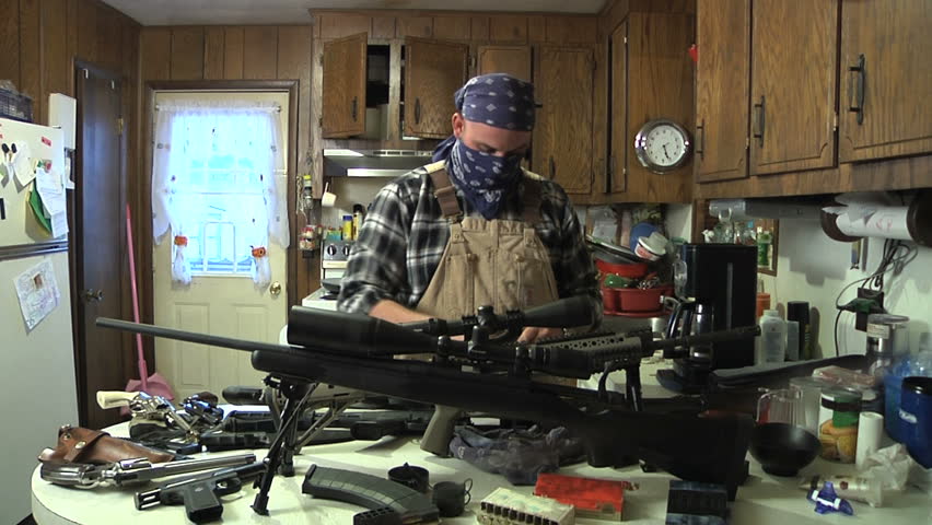 Man loads clips in kitchen