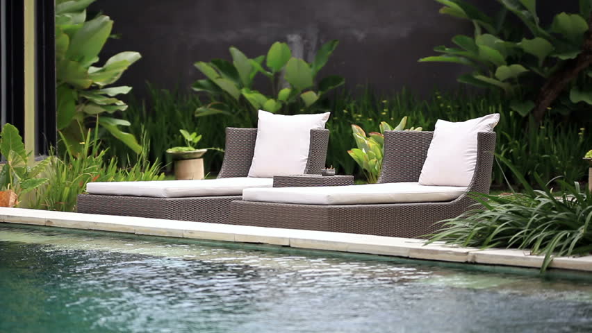 Deckchairs near pool, Seminyak, Bali.