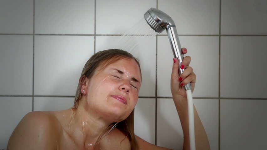 Young woman taking a shower