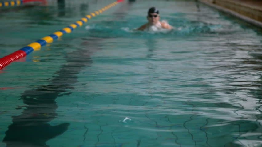Young swimmer performing the butterfly stroke