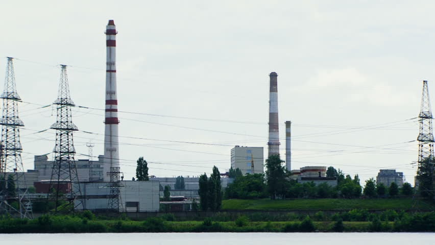 Nuclear power in nature. A huge corps of nuclear power stations against a background of beautiful sky. Moving camera.