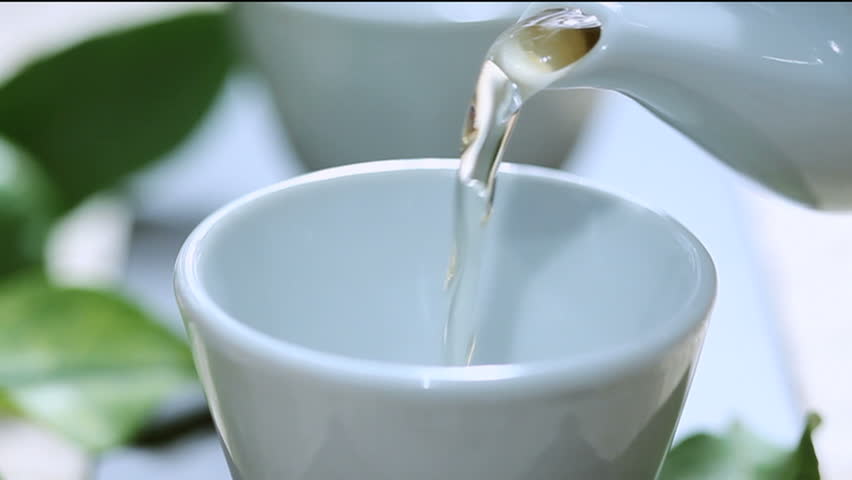 pouring tea zooming out