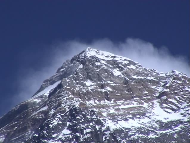 cloud blowing violently over mount Everest, Nepal, seen from the west.
