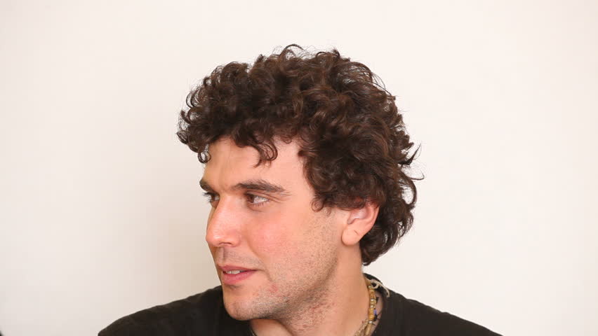 Young Man Caressing His Hairs