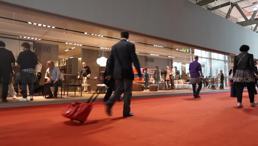 MILAN - APRIL 13: People walk trough stands at Salone del Mobile, international furnishing accessories exhibition on April 13, 2011 in Milan, Italy. 