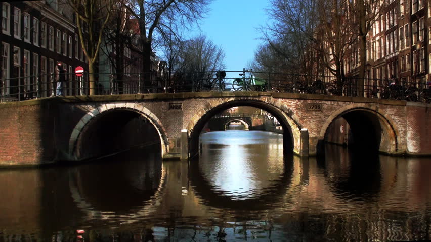 Amsterdam Bridge Typical Amsterdam canal bridge with cyclist.