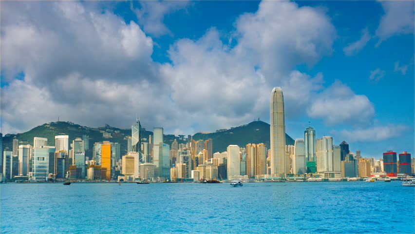 Hong Kong in the rays of the rising sun. Timelapse