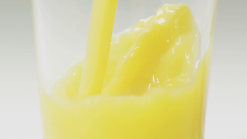 pouring orange juice