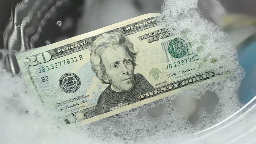 Twenty dollars in a washing machine. Washing machine stuffed with money