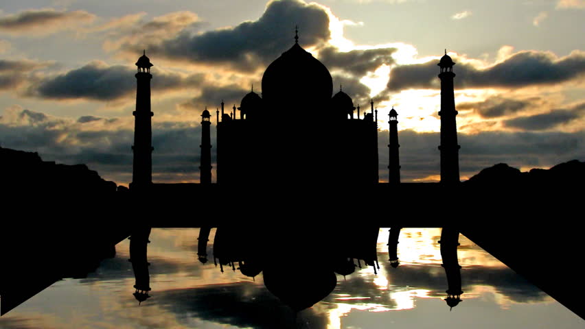 Taj Mahal during sunset with the reflecting lake in front of it.