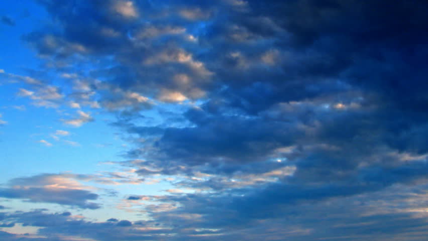 Rainy clouds passing on a blue sky.