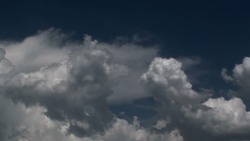 Time Lapse, Fast moving monsoon clouds spew across afternoon sky. 1080p