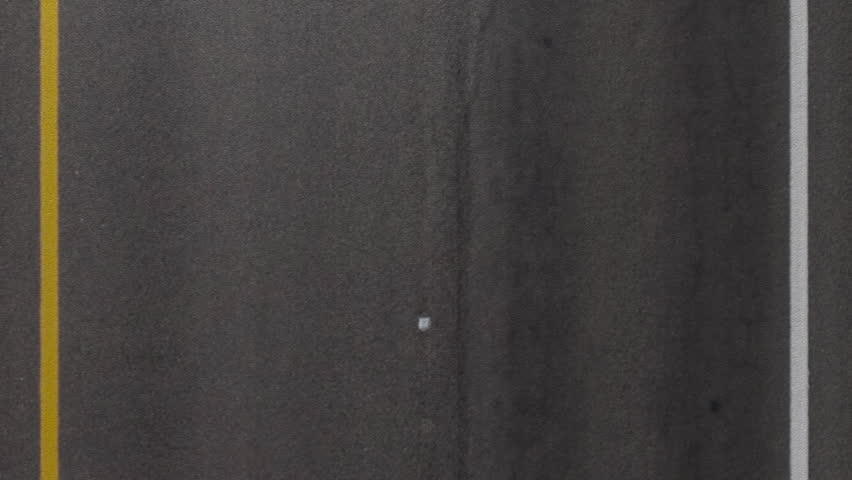 Cruising down a road, close up.