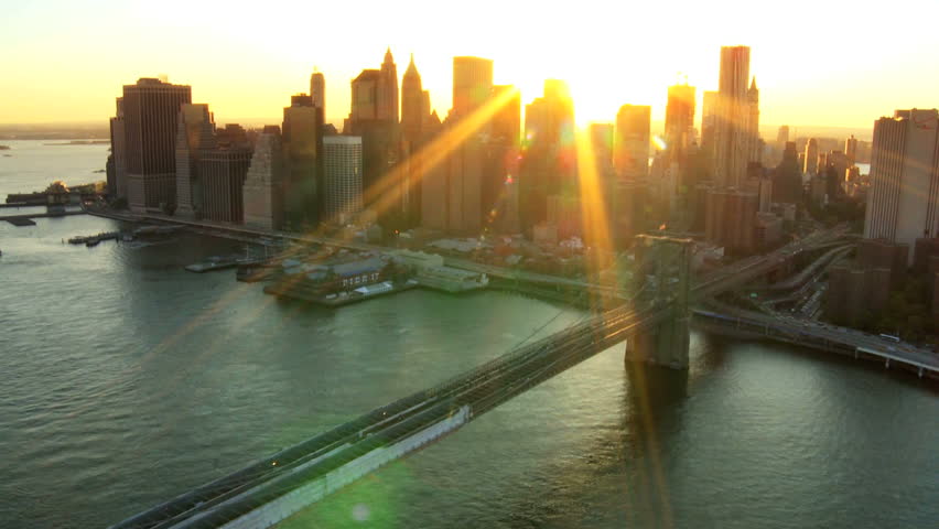Aerial view of New York Financial District of Manhattan, Brooklyn Bridge and the Hudson River at Sunset, North America, USA