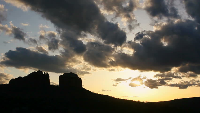 Time Lapse, Sunset over craggy Western mountain buttes. 1080p