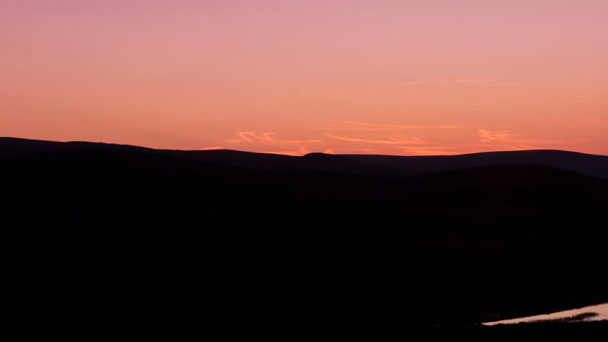sunrise from behind the mountains, timelapse move