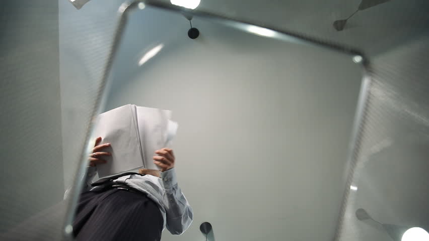 Man throws away paper documents