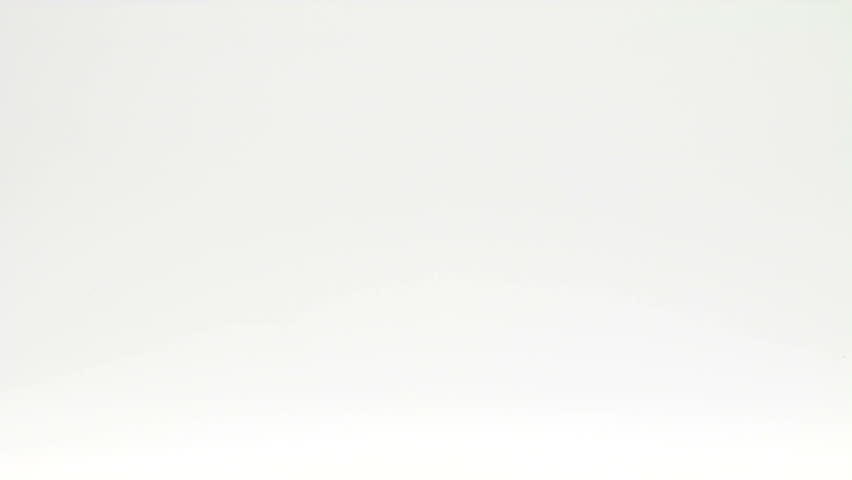 Mouse walking across a white surface