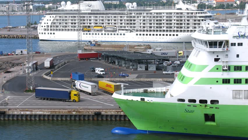 HELSINKI, FINLAND - JUNE 30: (Timelapse View) Cargo trucks pass by big ferry ship bow on June 30, 2011 in Helsinki, Finland. 