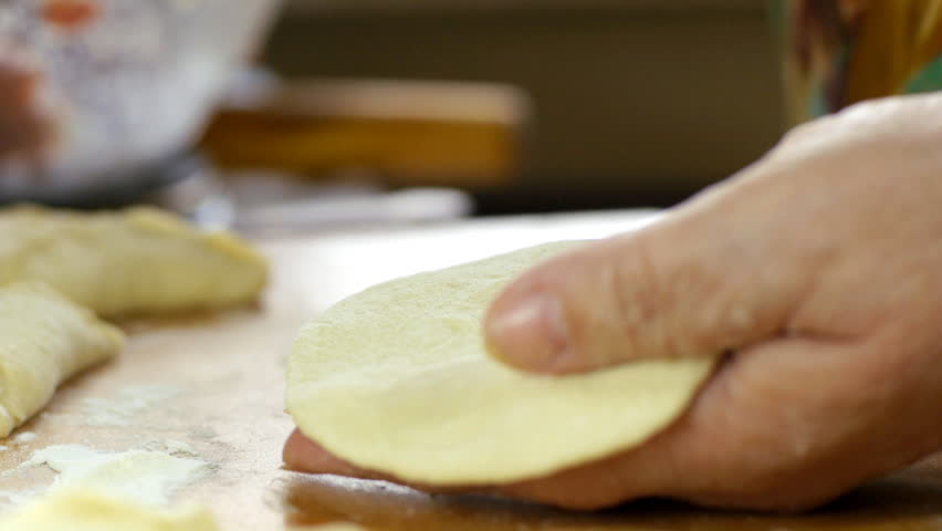 Rolling out the paste and cooking. Sequence of shots.
