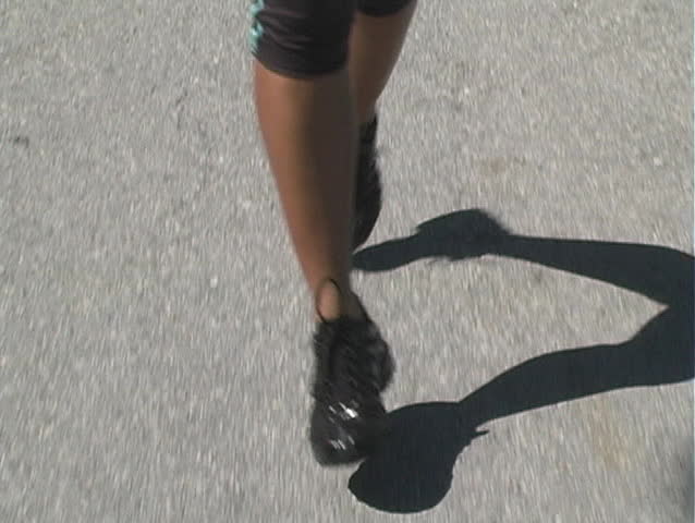 Close-up of female jogger's legs and feet.