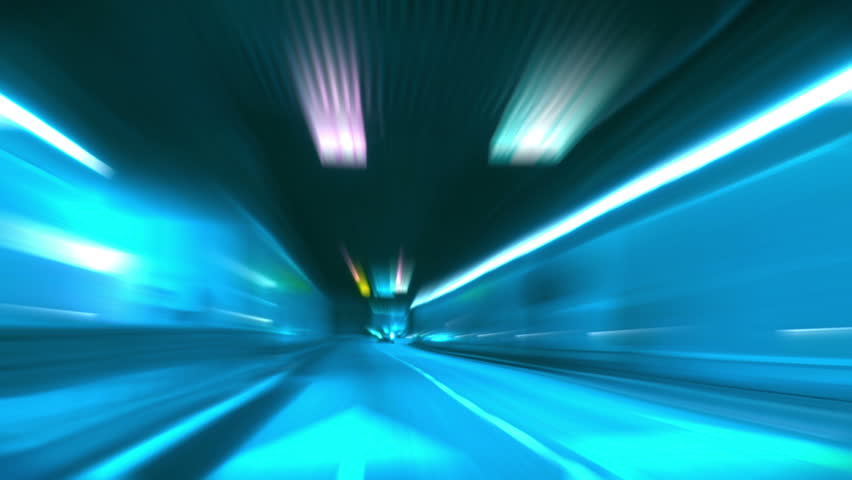 Driving through tunnel, abstract with motion blur and glow.
