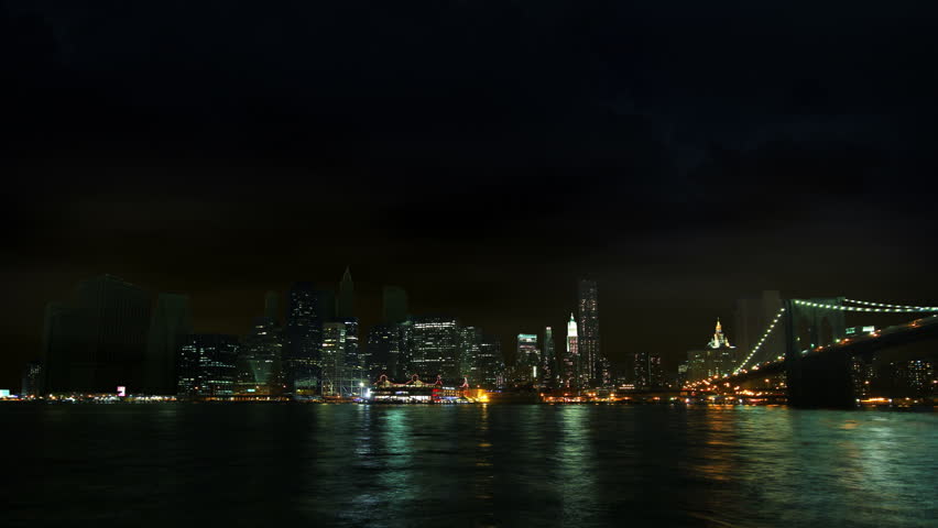 Time-lapse of New York City Skyline (south street seaport) at stormy weather, night shot