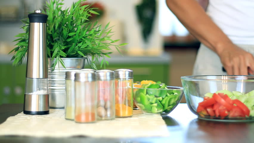 Female hands slicing red tomato, dolly shot