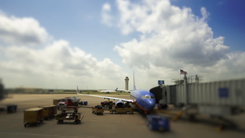 Timelapse of baggage being unloaded at an airport