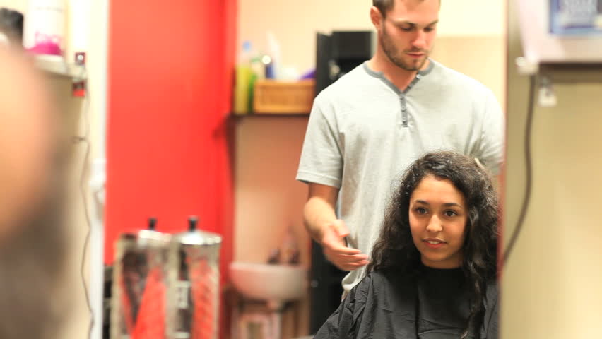Student having an haircut in a hairdressing salon