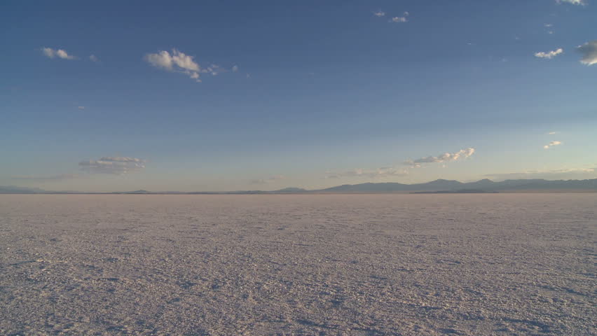 Camera pans across the Bonneville Salt Flats during sunset