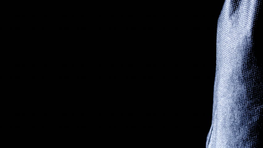 An African man dribbles a basketball.