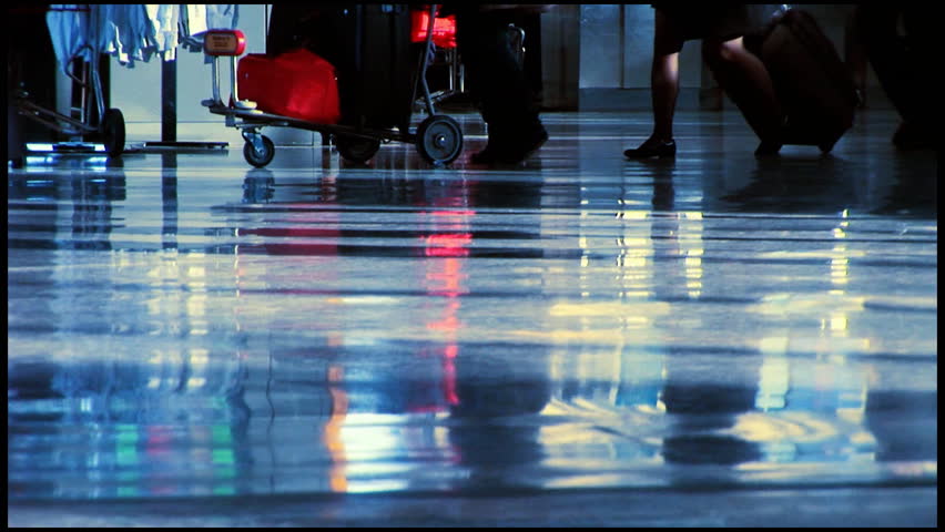 People travelling through airport terminal