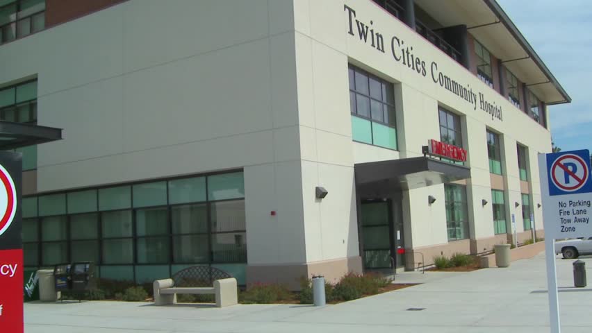 KANSAS CITY, MISSOURI - CIRCA 2009: Pan from a hospital facade to an emergency room entrance.