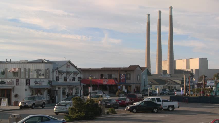 The town of Morro Bay in California with industrial smokestacks in background.