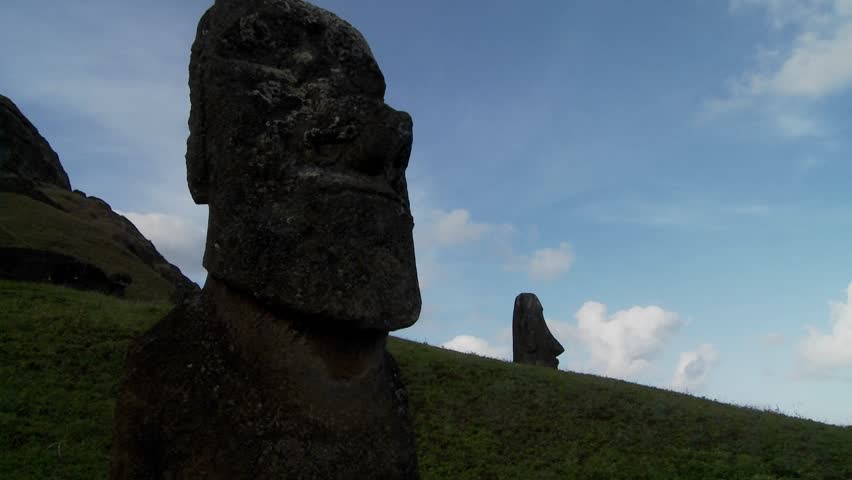 A time lapse of clouds moving behind Easter Island statues.