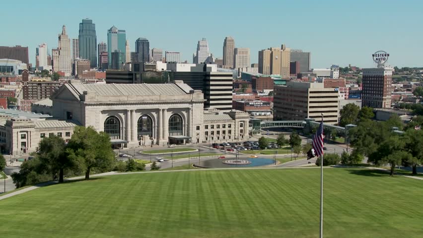 A daytime view of the Kansas City, Missouri skyline including Union Station in foreground.