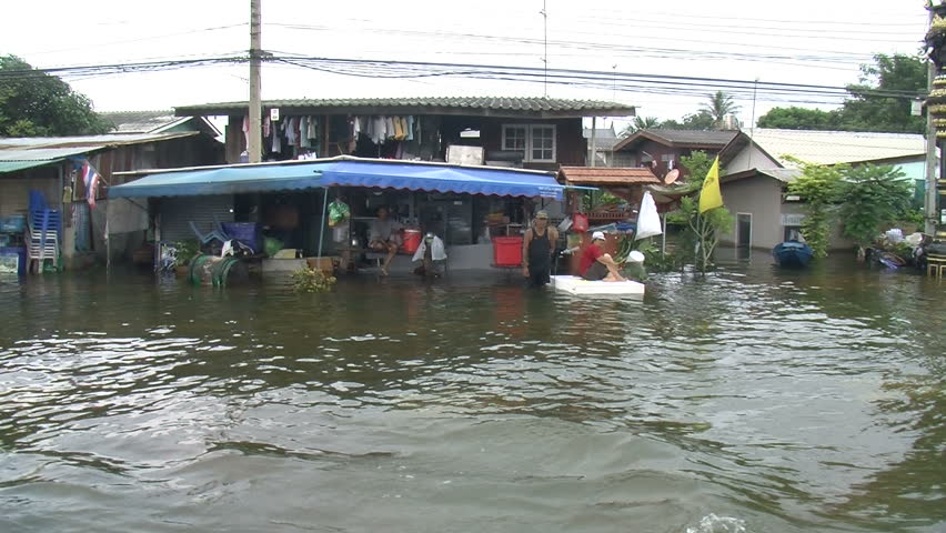 AYUTTHAYA, THAILAND - OCTOBER 12: POV boat traffic through the city on October 12, 2011, Ayutthaya, Thailand. Parts of Thailand are now experiencing the worst floods in half a century, as water inundates villages, historic temples, farms, and factories.