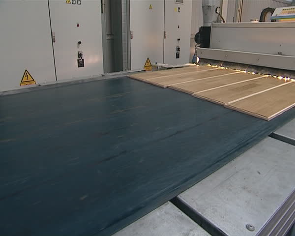 Last stage of click the panels production is varnishing. Timber industry factory. 