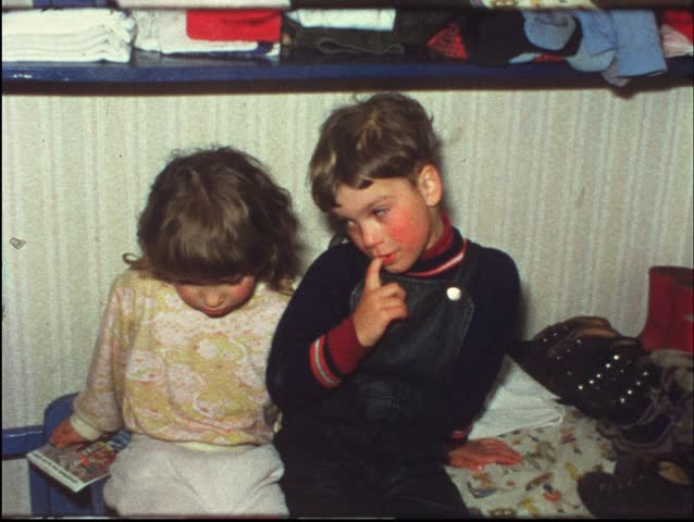 Sad brother wants her sister to comfort him (Vintage 8 mm amateur film)