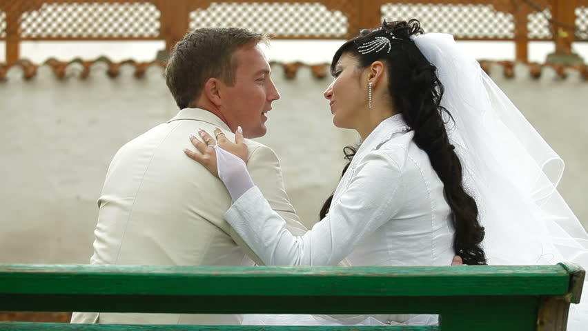 Crimean Tatar newlyweds sitting in the park 