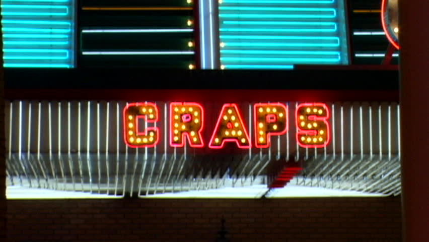 Neon red and gold craps sign