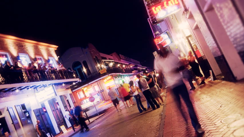 NEW ORLEANS - CIRCA 2010: People walking down Bourbon Street circa 2010 in New Orleans.