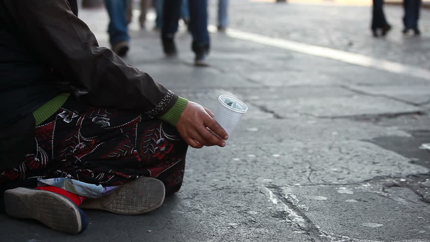 Woman homeless in city begging