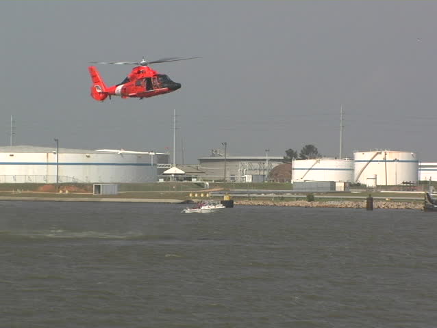 Coast Guard helicopter performing a river rescue