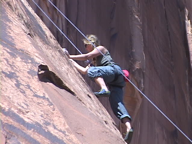 MOAB, UTAH - CIRCA 2001: A rock climber scales a wall circa 2001 in Moab, UT.