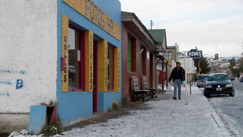 PATAGONIA, SOUTH AMERICA - CIRCA 2009: People walk on the streets of an Argentinan or Chilean town in winter circa 2009 in Patagonia.