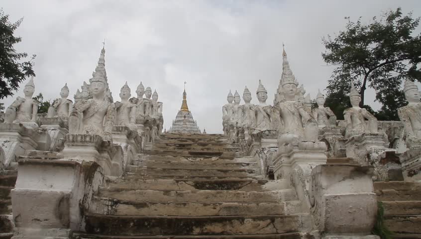 MINGUN, MYANMAR - AUGUST 20: People walk steps of the Mingun temple, August 20, 2011, Mingun, Myanmar. The Mingun temple is a monumental uncompleted stupa began by King Bodawpaya in 1790.