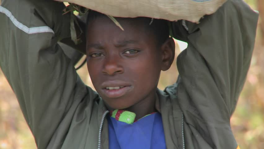 KENYA, AFRICA - CIRCA 2009: An  African child smiles at camera circa 2009 in Kenya.